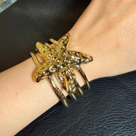 644 “ARENA” Brazalete dorado